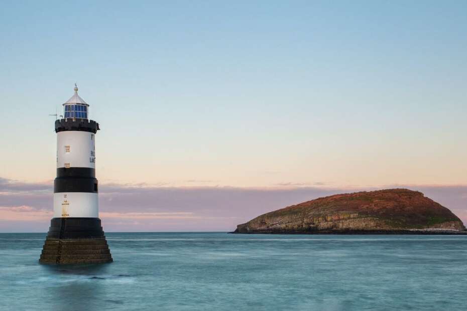 Anglesey lighthouses, lighthouse in sea.