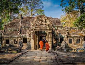Cheapest Asian country to visit, Cambodia. Monks at Angkor Wat.