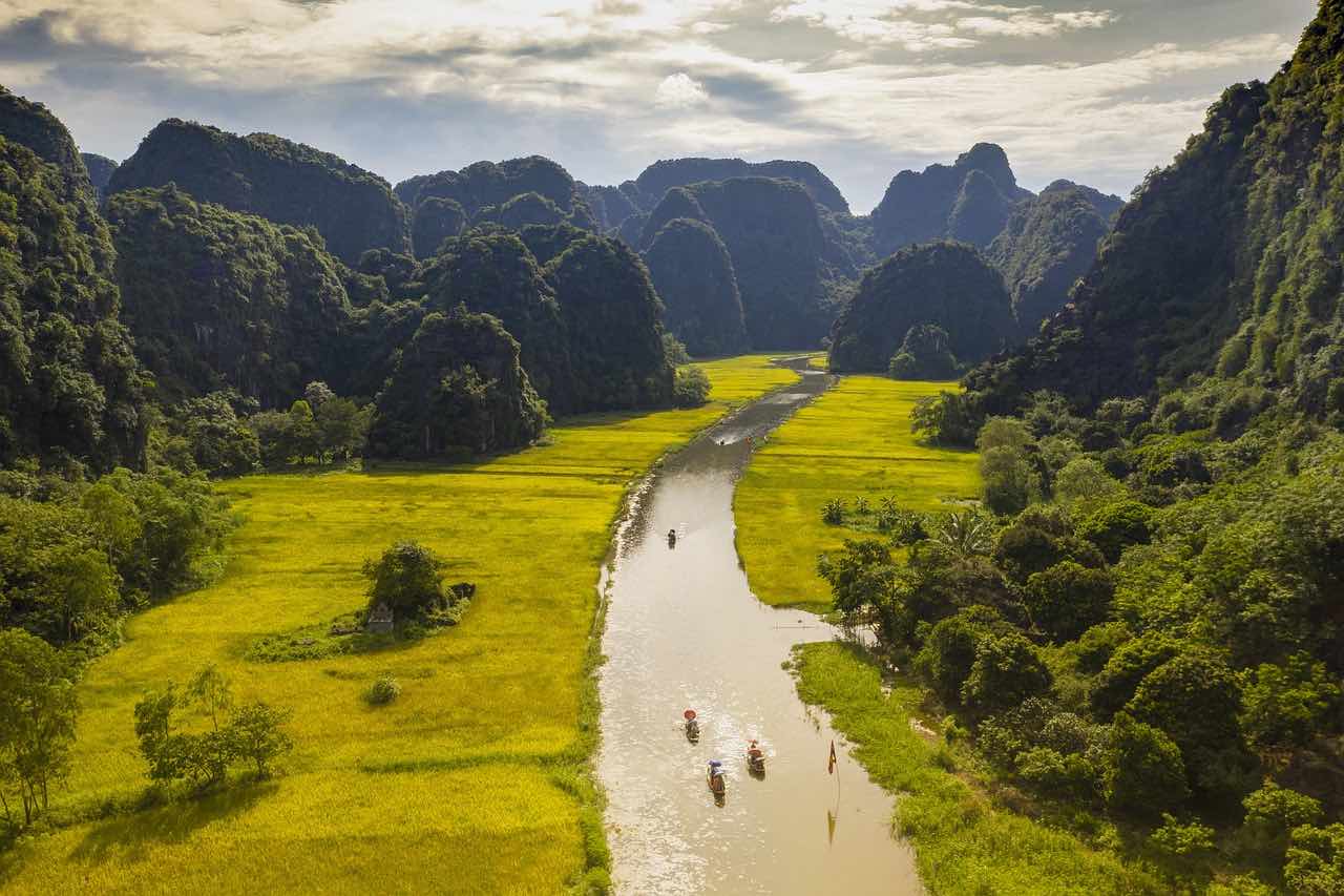 Tam Coc boat tour, boats on a river in Vietnam.
